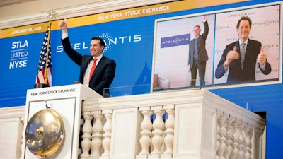 In this photo provided by the New York Stock Exchange, NYSE Vice Chairman John Tuttle, left, Stellantis CEO Carlos Taveras, center, and Chariman John Elkann, right, virtually ring the NYSE opening bell.