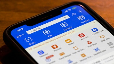 This July 20, 2020, file photo, shows, the app for Alipay, the mobile payments service operated by Ant Group, on a smartphone in Beijing. President Donald Trump has signed an executive order banning transactions with eight Chinese apps, including Alipay and WeChat Pay. However, the order goes into effect after President-elect Joe Biden takes office, so the order's ultimate fate is unclear.