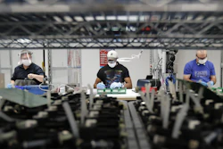 Ford Motor Co. line workers put together ventilators at the Ford Rawsonville plant, Ypsilanti Township, Mich., May 13, 2020.