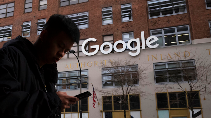 A man walks past Google's offices in New York, Dec. 17, 2018.