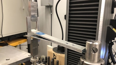 Sandia National Laboratories researchers in the Mechanics of Materials department utilize the new fracture testing hangers for traditional interlaminar composite fracture testing as well as advanced hybrid composite laminates, as shown here.
