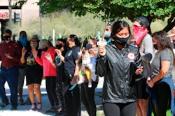 Naelyn Pike leads a prayer outside the federal courthouse in Phoenix, Feb. 2, 2021.