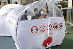 Designers stand inside a Portable Epidemiological Insulation Unit during a media presentation, Bogota, Colombia, Feb. 16, 2021.