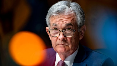 In this Dec. 1, 2020 file photo, Federal Reserve Chair Jerome Powell listens during a Senate Banking Committee hearing on Capitol Hill in Washington. Federal Reserve officials were convinced last month that the U.S. economy and job growth had slowed as coronavirus cases surged across the country. They noted that the economy's outlook is heavily dependent on the course of the virus.