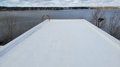 Final installation of recycled roof in Holland, MI.