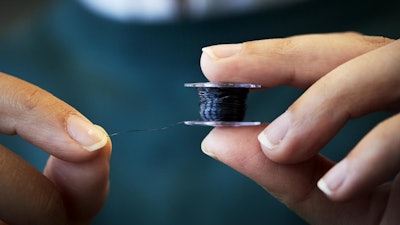 The cellulose thread is a renewable and non-toxic electrically conductive material for electronic textiles that can be sewn in an ordinary household sewing machine. It has a record-high conductivity for cellulose yarn and can handle at least five washes without losing its conductivity.