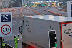 Trucks pass a checkpoint at the port in Dover, England, Dec. 31, 2020.