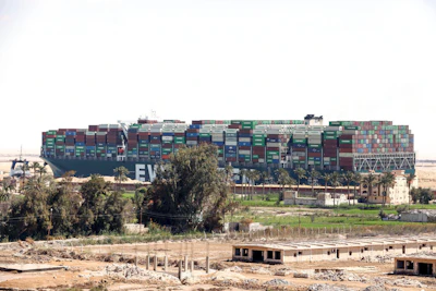 Ever Given, a Panama-flagged cargo ship blocks the Suez Canal almost a week after it got stuck sideways in the crucial waterway ib Monday, March 29.