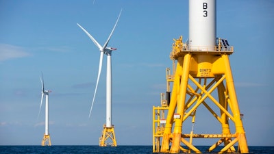 In this Aug. 15, 2016 file photo, three of Deepwater Wind's turbines stand in the water off Block Island, R.I. Though this is only one of two operational U.S. wind farms in 2021, members of the wind power industry and clean energy advocates are hoping that President Joe Biden's administration can transform the country into a leader in offshore wind power.