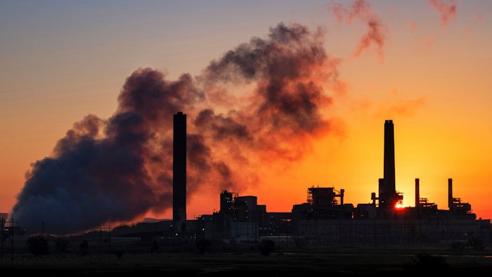 In this file photo, the Dave Johnson coal-fired power plant is silhouetted against the morning sun in Glenrock, Wyoming.