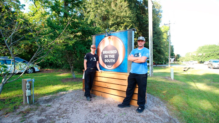 This photo provided by Hannah Albert on Sept. 23, 2020 shows Steve Klatt, left, and Brandon Lapp, owners of Braised in the South, a Johns Island, S.C, restaurant and food truck business that is having trouble finding workers during the pandemic. Many small businesses find hiring more difficult because many would-be staffers fear contracting COVID-19 on the job or would prefer to live off unemployment benefits.