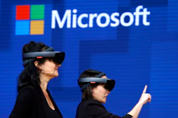 Members of a design team at Cirque du Soleil demonstrate Microsoft's HoloLens at the company's developers conference in Seattle, May 11, 2017.