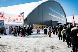 People wait in line to vote in the Inussivik arena in Nuuk, Greenland, April 6, 2021.
