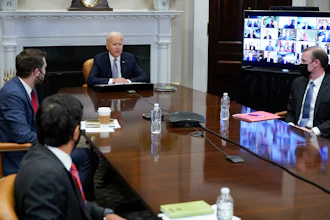 President Joe Biden participates virtually in the CEO Summit on Semiconductor and Supply Chain Resilience in the Roosevelt Room of the White House, Monday, April 12, 2021, in Washington. Seated with Biden are Daleep Singh, Deputy National Security Adviser and Deputy Director of the National Economic Council, clockwise from bottom left, National Economic Council Director Brian Deese, National Security Adviser Jake Sullivan and Commerce Secretary Gina Raimondo.