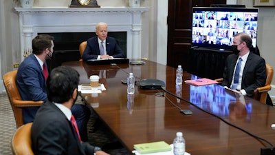 President Joe Biden participates virtually in the CEO Summit on Semiconductor and Supply Chain Resilience in the Roosevelt Room of the White House, Monday, April 12, 2021, in Washington. Seated with Biden are Daleep Singh, Deputy National Security Adviser and Deputy Director of the National Economic Council, clockwise from bottom left, National Economic Council Director Brian Deese, National Security Adviser Jake Sullivan and Commerce Secretary Gina Raimondo.