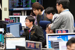 Staff of the Hayabusa2 Project watch monitors for a safety check at the control room of the JAXA Institute of Space and Astronautical Science in Sagamihara, Japan, Feb. 21, 2019.