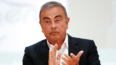 In this Sept. 29, 2020, file photo, Nissan's former executive Carlos Ghosn attends a press conference at the Holy Spirit University of Kaslik (USEK), north of Beirut, Lebanon. The trial of two Americans, Michael Taylor and his son Peter, accused of helping former Nissan Chairman Carlos Ghosn escape from Japan while out on bail will open on June 14, the Tokyo District Court said Wednesday, April 28, 2021.