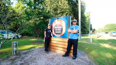 This photo provided by Hannah Albert on Sept. 23, 2020 shows Steve Klatt, left, and Brandon Lapp, owners of Braised in the South, a Johns Island, S.C, restaurant and food truck business that is having trouble finding workers during the pandemic. Many small businesses find hiring more difficult because many would-be staffers fear contracting COVID-19 on the job or would prefer to live off unemployment benefits.