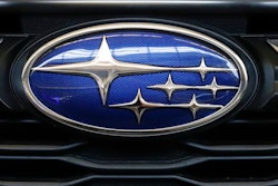 In this Feb. 14, 2019, file photo the Subaru logo on the front grill of a 2019 Subaru Impreza sedan is displayed at the 2019 Pittsburgh International Auto Show in Pittsburgh. Subaru is recalling nearly 875,000 cars and SUVs in the U.S. because the engines can stall or a rear suspension part can fall off. The stalling recall covers more than 466,000 Crosstrek SUVs from 2018 and 2019 and Impreza cars from 2017 through 2019.