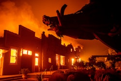 In this file photo, flames from the Kincade Fire consume Soda Rock Winery in Healdsburg, California.