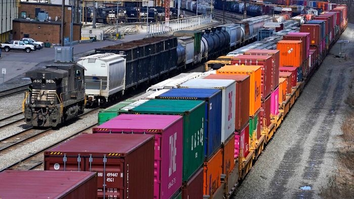 In this April 2, 2021, file photo train consists are formed at Norfolk and Southern Railroad's Conway Yard in Conway, Pa. Even as railroads are operating longer and longer freight trains that can stretch for two miles or more, the companies have drastically reduced staffing levels, prompting unions to warn that moves meant to increase profits could endanger safety and even result in disasters.