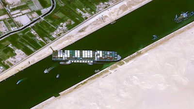 This satellite image from Cnes2021, Distribution Airbus DS, shows the cargo ship MV Ever Given stuck in the Suez Canal near Suez, Egypt on March 25.