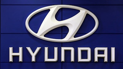This July 26 2018 file photo shows the logo of Hyundai Motor Co. in Seoul, South Korea. Hyundai plans to invest $7.4 billion in the U.S. by 2025 to make electronic vehicles, enhance production facilities and invest further in smart mobility solutions. Hyundai Motor Group, which includes Hyundai Motor Co. and Kia Corp., said Thursday, May 13, 2021, that Hyundai and Kia will invest in growing its electronic manufacturing footprint to scale production and satisfy U.S. market demands.