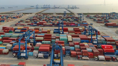 In this April 8, 2021 file photo, a container port on the Yangtze River is seen in an aerial view in Nantong in eastern China's Jiangsu province.