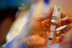 In this Dec. 29, 2020, file photo, Pat Moore, with the Chester County, Pa., Health Department, fills a syringe with Moderna COVID-19 vaccine before administering it to emergency medical workers and health care personnel at the Chester County Government Services Center in West Chester, Pa. Moderna says its COVID-19 vaccine strongly protects kids as young as 12. The company released the preliminary findings Tuesday, May 25, 2021, based on testing on more than 3,700 12- to 17-year-olds in the United States.