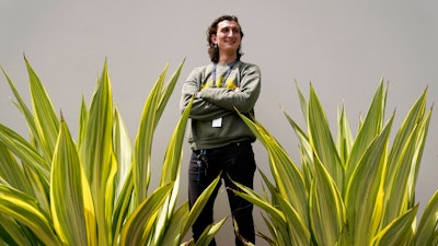 Lucius Giannini stands for a portrait Thursday, April 15, 2021, in San Diego. Giannini graduated from the University of California at San Diego at the end of last summer with a degree in political science. He had hoped to find work with the Peace Corps, or maybe teaching English overseas. But the Peace Corps was bringing all its volunteers home, and no one was hiring for overseas teaching.