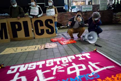 In this March 25, 2021, file photo, a 'No Olympics' banner is placed by protesters in Tokyo during a demonstration against the going ahead of the Tokyo 2020 Olympic and Paralympic Games. An online petition calling for the Tokyo Olympics to be canceled has gained ten of thousands of signatures since being launched in Japan just a few days ago. The rollout comes with Tokyo, Osaka and several other areas under a state of emergency with coronavirus infections rising — particularly new variants.