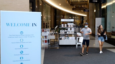 Shoppers exit a shopping mall in Chicago downtown.