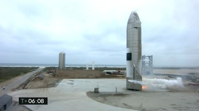 In this image from video made available by SpaceX, a Starship test vehicle sits on the ground after returning from a flight test in Boca Chica, Texas on Wednesday, May 5, 2021
