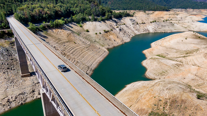 A home destroyed in the 2020 North Complex Fire sits above Lake Oroville on Sunday, May 23, 2021, in Oroville, CA. At the time of this photo, the reservoir was at 39 percent of capacity and 46 percent of its historical average.