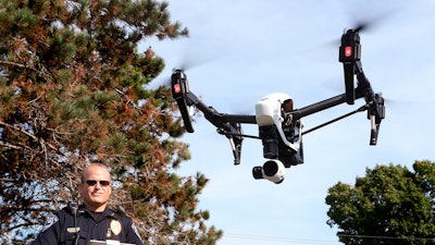 In this Sept. 16, 2015 file photo, West Salem police chief Charles Ashbeck flies his department's new drone in West Salem, Wis.