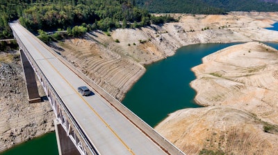 A home destroyed in the 2020 North Complex Fire sits above Lake Oroville on Sunday, May 23, 2021, in Oroville, CA. At the time of this photo, the reservoir was at 39 percent of capacity and 46 percent of its historical average.