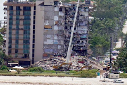 Workers search in the rubble at the Champlain Towers South Condo, Saturday, June 26, 2021, in Surfside, Fla. One hundred fifty-nine people were still unaccounted for two days after Thursday's collapse, which killed at least four.