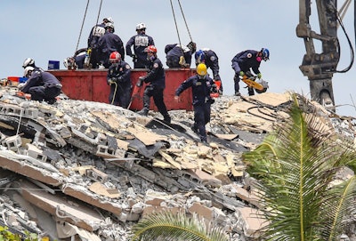 South Florida Urban Search and Rescue team look for survivors at the 12-story oceanfront condo, Champlain Towers South on Saturday, June 26, 2021, that partially collapsed early Thursday morning in the Surfside area of Miami.