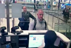 Image from security camera video showing Michael L. Taylor, center, and George-Antoine Zayek at passport control at Istanbul Airport, Turkey, Dec. 30, 2019.