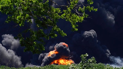 Flames and smoke are seen from an explosion at a chemical plant in Rockton, Ill., Monday, June 14, 2021.