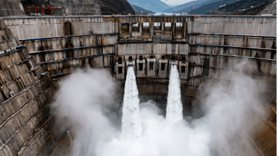 In this photo released by Xinhua News Agency, water is released from the dam of Baihetan hydropower station in Ningnan county, in southwestern China's Sichuan province on June 27, 2021.
