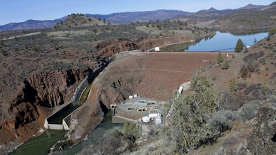 This March 3, 2020, file photo, shows the Iron Gate Dam, powerhouse and spillway on the lower Klamath River near Hornbrook, Calif. A proposal to demolish four dams on the lower Klamath River advanced Thursday, June 17, 2021, when federal regulators allowed the utility company that operates them to exit its license. The decision removes a key hurdle to plans for the largest dam demolition project in U.S. history. PacifiCorp will surrender its license for the hydroelectric dams to the non-profit Klamath River Renewal Corporation and the states of Oregon and California.