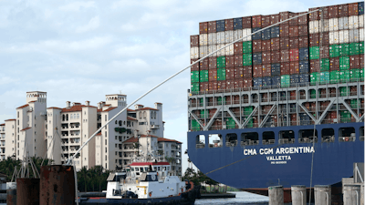This April 6, 2021 photo shows the CMA CGM Argentina arrives at PortMiami in Miami. The U.S. economy grew at a solid 6.4% rate in the first three months of this year.