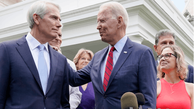 President Joe Biden speaks with Sen. Rob Portman, R-Ohio, and other bipartisan group of senators, Thursday June 24, 2021, outside the White House in Washington.