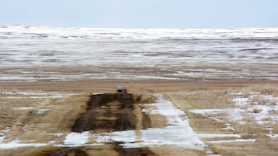 In this March 11, 2020, file photo provided by the Bureau of Land Management, shows the proposed route of the Keystone XL oil pipeline where it crosses into the United States from Canada in Phillips County, Mont. Calgary-based TC Energy, sponsor of the Keystone XL crude oil pipeline, said Wednesday, June 9, 2021, that it was pulling the plug on the contentious project after Canadian officials failed to convince President Joe Biden to reverse its cancellation of its permit on the day he took office.