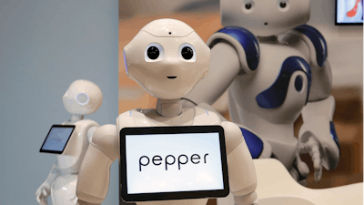 In this May 25, 2016, file photo, Pepper, the robot of Softbank Robotics Europe, performs during the Innorobo European summit, an event dedicated to the service robotics industry in Aubervilliers, outskirts of Paris.