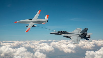 The Boeing MQ-25 T1 test asset transfers fuel to a U.S. Navy F/A-18 Super Hornet on June 4, marking the first time in history that an unmanned aircraft has refueled another aircraft. The MQ-25 Stingray will assume the carrier-based tanking role currently performed by F/A-18s, allowing for better use of the combat strike fighters and helping extend the range of the carrier air wing.