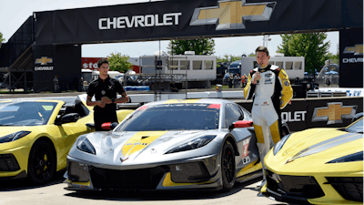 Drivers Jordan Taylor, left, and Tommy Milner attend a news conference while standing next to a Corvette C8.R race car Wednesday, June 9, 2021, at Raceway at Belle Isle in Detroit.