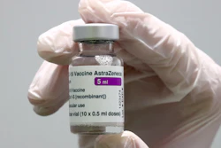 In this file photo, medical staff prepares an AstraZeneca coronavirus vaccine.