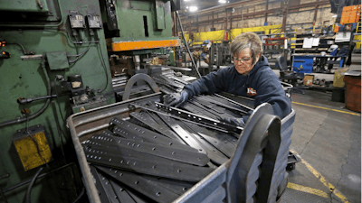 In this April 22 photo, Marie Tibbott sorts product at EIP Manufacturing in Earlville, Iowa.